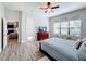 Spacious bedroom with wood flooring, large windows and a walk-in closet at 11409 Drifting Leaf Dr, Riverview, FL 33579