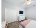 Well-lit bedroom with double bed, large closet, and ceiling fan at 11409 Drifting Leaf Dr, Riverview, FL 33579