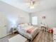 Cozy bedroom with a full-size bed, nightstands, and white dresser at 11409 Drifting Leaf Dr, Riverview, FL 33579