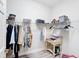 Walk-in closet with shelves, hanging rods and a small desk at 11409 Drifting Leaf Dr, Riverview, FL 33579