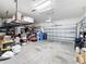 Garage with overhead storage and space for various items at 11409 Drifting Leaf Dr, Riverview, FL 33579