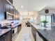 Eat-in kitchen with island and view to dining area at 11409 Drifting Leaf Dr, Riverview, FL 33579