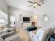 Living room boasts a large TV, comfy seating, and an open floor plan at 11409 Drifting Leaf Dr, Riverview, FL 33579
