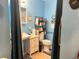 Bathroom with walk-in shower, toilet, and vanity with drawers at 11625 Meadowlane Dr, Dade City, FL 33525