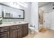 Bathroom featuring a vanity with granite countertop and tiled backsplash, toilet and shower and tub at 12306 Woodlands Cir, Dade City, FL 33525