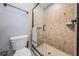 Modern bathroom featuring a glass-enclosed shower with decorative tile at 12306 Woodlands Cir, Dade City, FL 33525