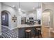Updated kitchen featuring granite counters, stainless steel appliances, island, and stylish floors at 12306 Woodlands Cir, Dade City, FL 33525