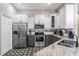 Well-appointed kitchen with stainless steel appliances, granite countertops, and ample cabinetry at 12306 Woodlands Cir, Dade City, FL 33525