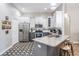 Stylish kitchen features stainless steel appliances, granite countertops, and patterned flooring at 12306 Woodlands Cir, Dade City, FL 33525