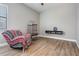 Bright Living room with an armchair, wood flooring and a modern table with a TV at 12306 Woodlands Cir, Dade City, FL 33525