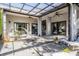 Covered patio with comfortable seating, a lounge, and rock garden at 12306 Woodlands Cir, Dade City, FL 33525