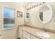 Clean bathroom with double vanity and oval mirrors at 1326 Hatcher Loop Dr, Brandon, FL 33511