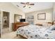 Bright bedroom with a ceiling fan and view of backyard at 1326 Hatcher Loop Dr, Brandon, FL 33511