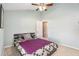 Guest bedroom with a ceiling fan and purple blanket at 1326 Hatcher Loop Dr, Brandon, FL 33511