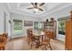 Bright dining room with hardwood floors and a wooden table at 13810 Walden Sheffield Rd, Dover, FL 33527