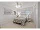 Bedroom with double bed, nightstands and ceiling fan at 1480 Santa Monica Dr, Dunedin, FL 34698