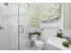 Clean bathroom with white tile, glass shower, and updated vanity at 151 18Th Ne Ave, St Petersburg, FL 33704