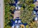 Condo building with private parking and surrounding trees at 1901 Lennox E Rd # 1901, Palm Harbor, FL 34683