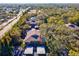 Condo building with private parking and surrounding trees at 1901 Lennox E Rd # 1901, Palm Harbor, FL 34683