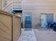 Private back patio with brick pavers, fenced yard, and access to upper floor stairwell at 1901 Lennox E Rd # 1901, Palm Harbor, FL 34683