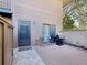 Cozy back patio with grill, outdoor seating, and a charming fenced area with garden at 1901 Lennox E Rd # 1901, Palm Harbor, FL 34683