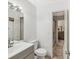 Bathroom featuring a vanity with modern fixtures, toilet, and a shower through an open doorway at 1901 Lennox E Rd # 1901, Palm Harbor, FL 34683