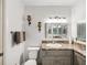 Bathroom with a granite vanity, modern lighting, and vanity mirror at 1901 Lennox E Rd # 1901, Palm Harbor, FL 34683