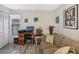 Living room featuring desk, comfortable seating, vintage decor, and wood-look floors at 1901 Lennox E Rd # 1901, Palm Harbor, FL 34683