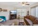 Comfortable living room with a ceiling fan, large windows, and wood-look floors at 1901 Lennox E Rd # 1901, Palm Harbor, FL 34683