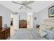 Spacious main bedroom with ceiling fan, ensuite bath, and walk-in closets at 1901 Lennox E Rd # 1901, Palm Harbor, FL 34683