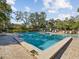 Enjoy this refreshing community pool with a spacious deck at 1901 Lennox E Rd # 1901, Palm Harbor, FL 34683