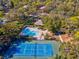 Relaxing pool and tennis court in a tree-lined community at 1901 Lennox E Rd # 1901, Palm Harbor, FL 34683