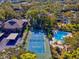 Community tennis court and refreshing pool area at 1901 Lennox E Rd # 1901, Palm Harbor, FL 34683