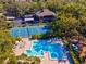 Aerial view of community pool and tennis court at 1901 Lennox E Rd # 1901, Palm Harbor, FL 34683