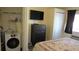 Bedroom with in-unit laundry, dresser, and closet at 20853 Haulover Cv # A8, Lutz, FL 33558