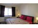 Comfortable bedroom with king-size bed and large window at 20853 Haulover Cv # A8, Lutz, FL 33558