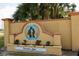 Community entrance with Paradise Lakes signage at 20853 Haulover Cv # A8, Lutz, FL 33558