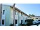 Side view of the building, highlighting its design and setting at 20853 Haulover Cv # A8, Lutz, FL 33558