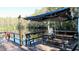 Lakefront deck with picnic table and string lights at 20853 Haulover Cv # A8, Lutz, FL 33558