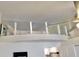 Upstairs loft bedroom with a bed and ceiling fan at 20853 Haulover Cv # A8, Lutz, FL 33558