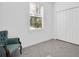 Simple bedroom with gray carpet and an accent chair at 3004 Abrams Trl, Odessa, FL 33556