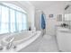 Main bathroom with a large bathtub and double vanity at 3010 Grand View Ave, Clearwater, FL 33759