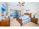 Bright bedroom with wood bed frame and water views at 308 Harbor Dr, Indian Rocks Beach, FL 33785