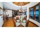 Bright dining area with glass table and chairs, hardwood floors, and a view at 308 Harbor Dr, Indian Rocks Beach, FL 33785