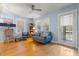 Living room with hardwood floors, comfy seating and large window at 308 Pennsylvania Ave, Clearwater, FL 33755