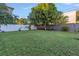 Spacious backyard with lush grass and wooden fence at 323 30Th N Ave, St Petersburg, FL 33704