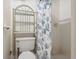 Small bathroom with shower and floral shower curtain at 3529 Windham Dr, Holiday, FL 34691
