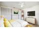 Virtually staged bedroom with yellow bedding and a dresser at 3529 Windham Dr, Holiday, FL 34691