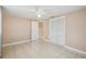Simple bedroom with tile flooring and mirrored closet doors at 3529 Windham Dr, Holiday, FL 34691