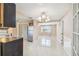 Kitchen with dark cabinets, granite counters, and white appliances at 3529 Windham Dr, Holiday, FL 34691